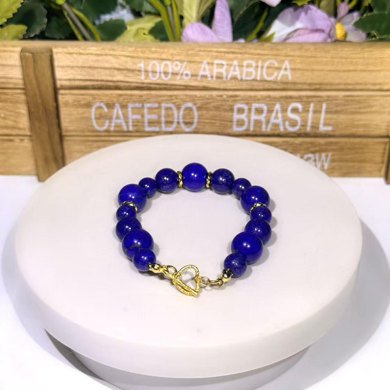 High-fashion celestial gradient choker necklace made of genuine Afghan Lapis Lazuli beads, showcasing a portrait silhouette that tapers beautifully to heavy 12mm centerpiece gemstones.