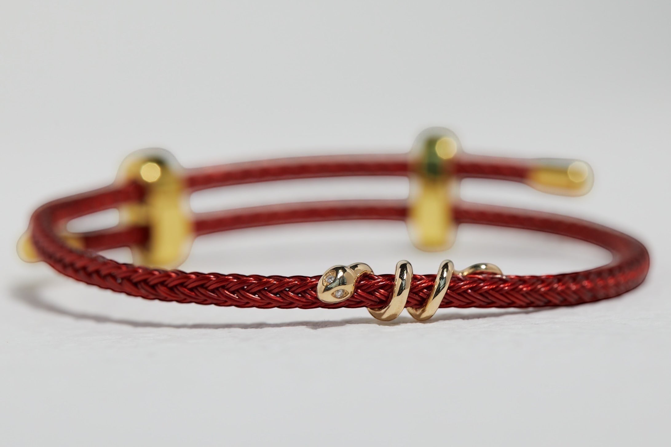 BoxUnboxed 18k solid gold snake bracelet with diamond eyes on red string cord, adjustable fit