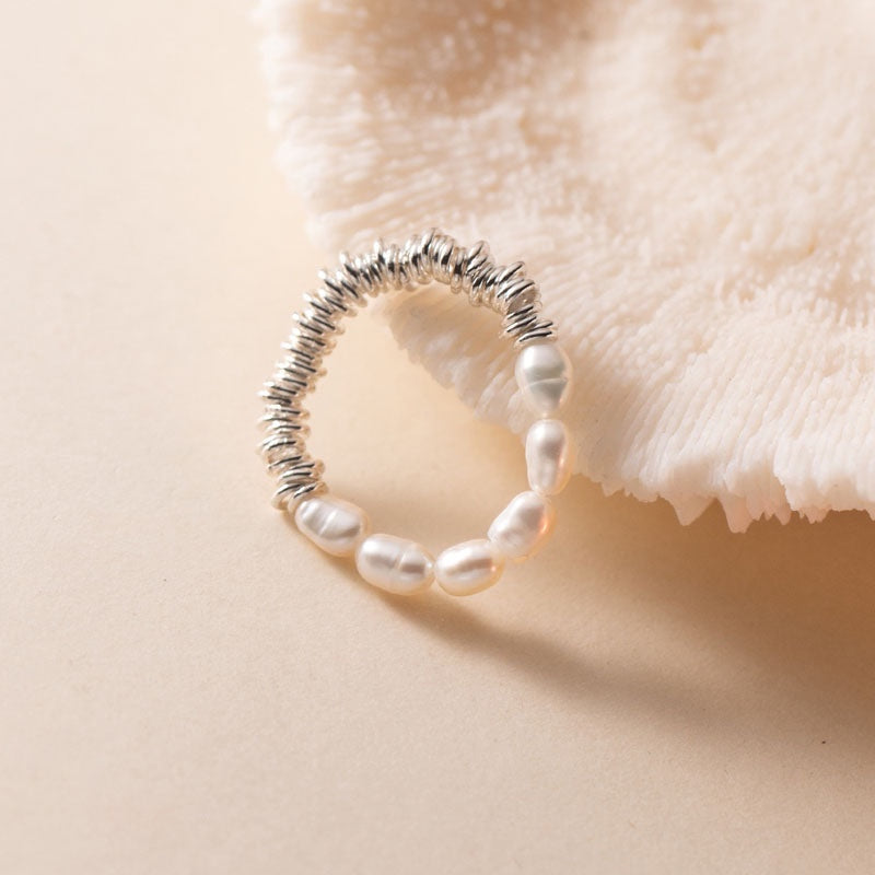BoxUnboxed baroque pearl and coiled sterling silver ring with a minimalist design and universal fit.