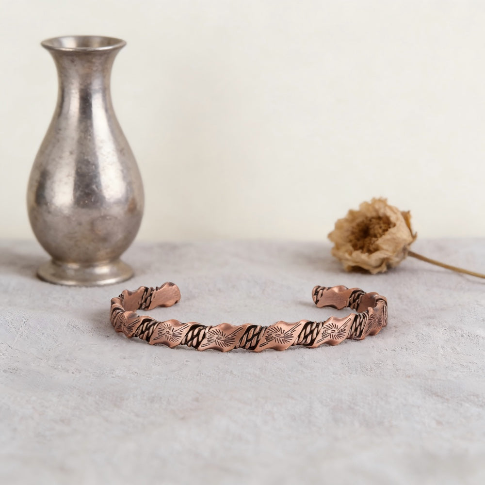 BoxUnboxed Helix Grounding Cuff featuring a twisted two-tone copper and silver-plated geometric weave on a textured base.