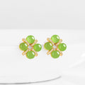 BoxUnboxed four-leaf clover stud earrings featuring cabochon green jadeite set in gold vermeil with pave accents.