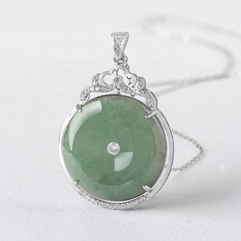 BoxUnboxed Grade A Myanmar jadeite peace buckle pendant in S925 sterling silver with pave halo and crown bail.