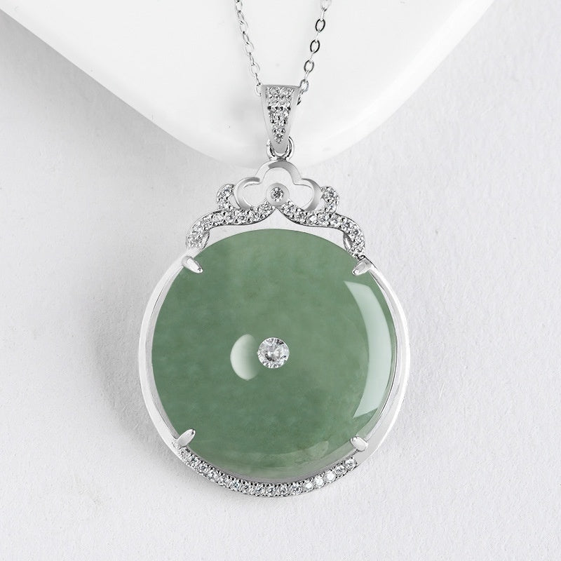 BoxUnboxed Grade A Myanmar jadeite peace buckle pendant in S925 sterling silver with pave halo and crown bail.