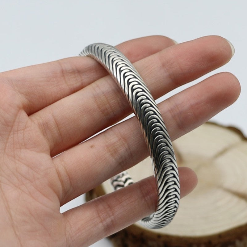BoxUnboxed Nordic Frost Artisan Braided Silver Cuff. Solid 925 silver, 35g, open cuff style with intricate braided texture and polished borders.